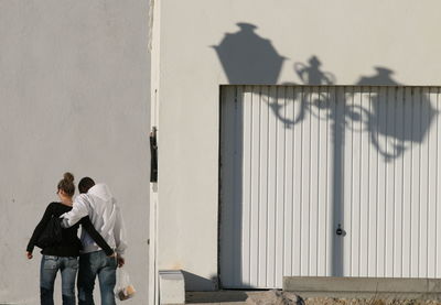 People standing against wall