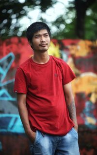 Portrait of young man standing outdoors