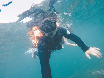 Woman swimming in undersea