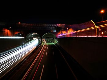 High angle view of light trails on road at night