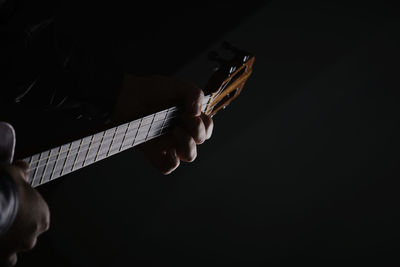 String cuatro instrument recording session, closeup, artist playing venezuelan folk music with 4 