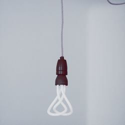 Close-up of lamp over white background