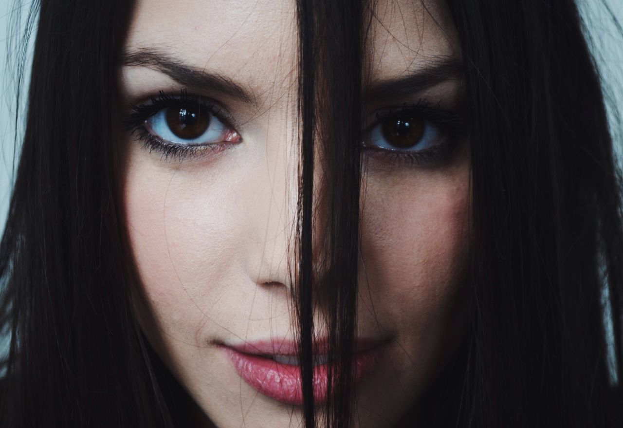 CLOSE-UP OF YOUNG WOMAN WITH HAIR