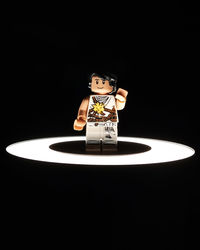 Close-up of electric lamp against black background
