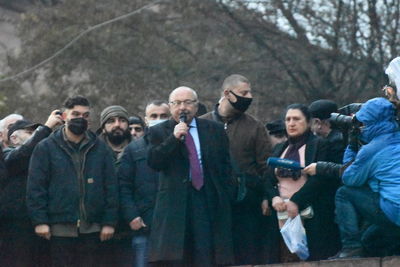 Group of people photographing in winter