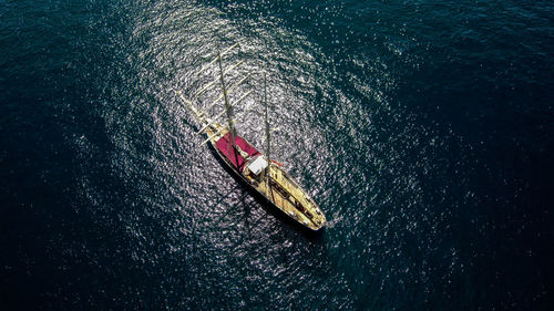 High angle view of sailboat sailing in sea