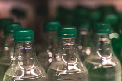 Close-up of wine bottles on table