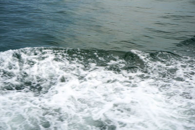 High angle view of water flowing in sea