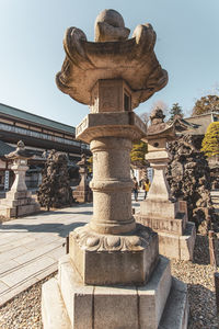 Statue of temple against sky