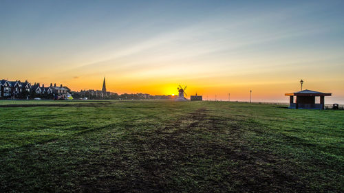 Scenic view of buildings against sky during sunset