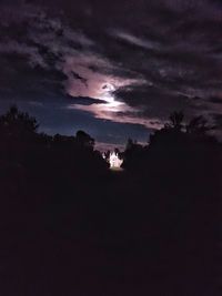 Scenic view of silhouette landscape against sky at night