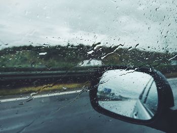 Road seen through wet window