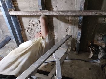 Low section of person in abandoned building