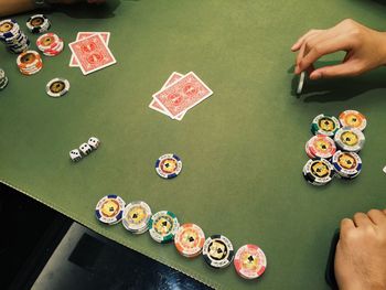 Man at table playing poker