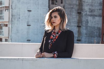 Young woman standing on terrace