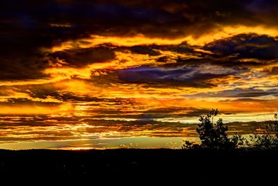 Scenic view of dramatic sky over sea during sunset