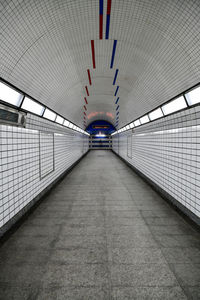 Long empty underground subway path