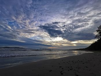 Scenic view of beach against sky during sunset