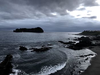 Scenic view of sea against sky at dusk