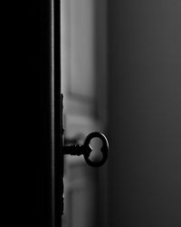 Close-up of key on door at home