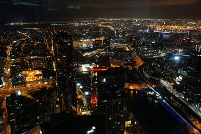 Aerial view of city lit up at night