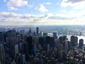 Aerial view of modern buildings in city against sky