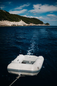 Boat in sea against sky