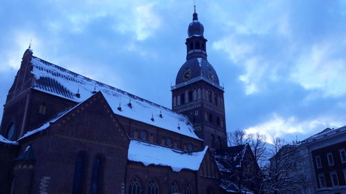 Low angle view of clock tower against sky