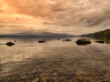 Scenic view of sea against cloudy sky