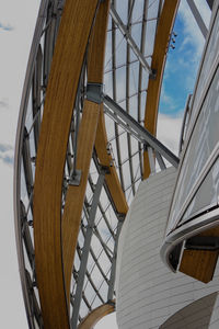 Low angle view of staircase by building against sky