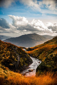 Scenic view of stream against sky