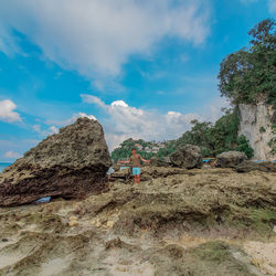 Low angle view of rock formations against sky