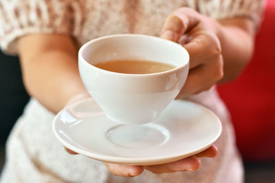Midsection of coffee cup