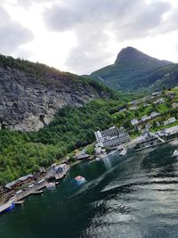 High angle view of river amidst mountains against cloudy sky