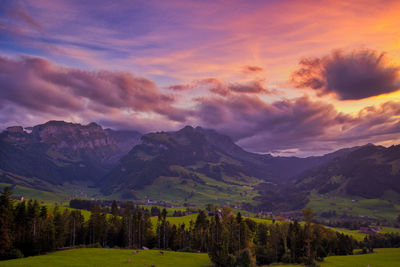 Scenic view of mountains against sky during sunset