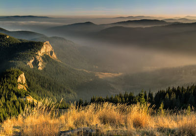 Scenic view of mountains against sky during sunset