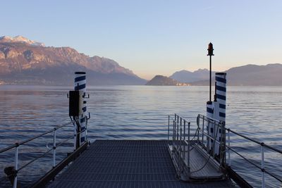 Scenic view of sea with mountain range in background