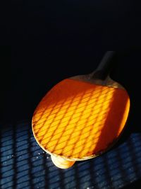 Close-up of orange against black background