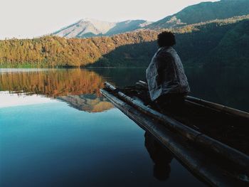 Scenic view of lake with mountains in background