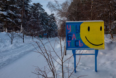 Information sign on snow covered land