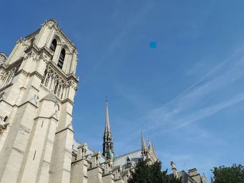 Low angle view of buildings against blue sky