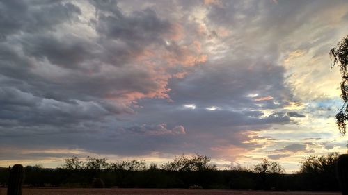 Scenic view of landscape against cloudy sky