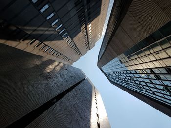 Low angle view of modern buildings against sky