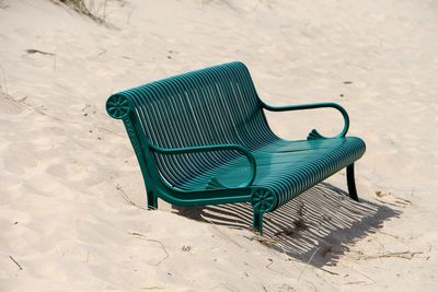 Empty chairs on beach