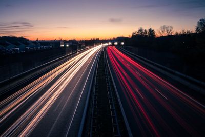 High angle view of light trails on highway at night