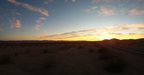 Scenic view of landscape at sunset