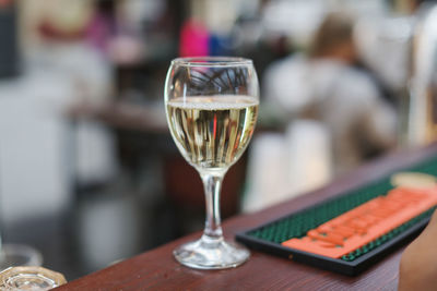 Close-up of wine glasses on table