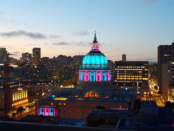 Illuminated buildings in city at night