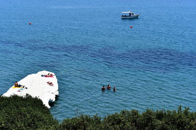 High angle view of people on sea