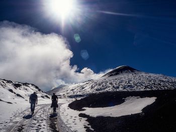 Scenic view of snow covered mountains against sky